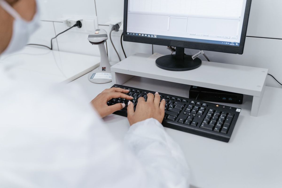 Lab staff entering orders in the new LIS during validation, training and go-live
